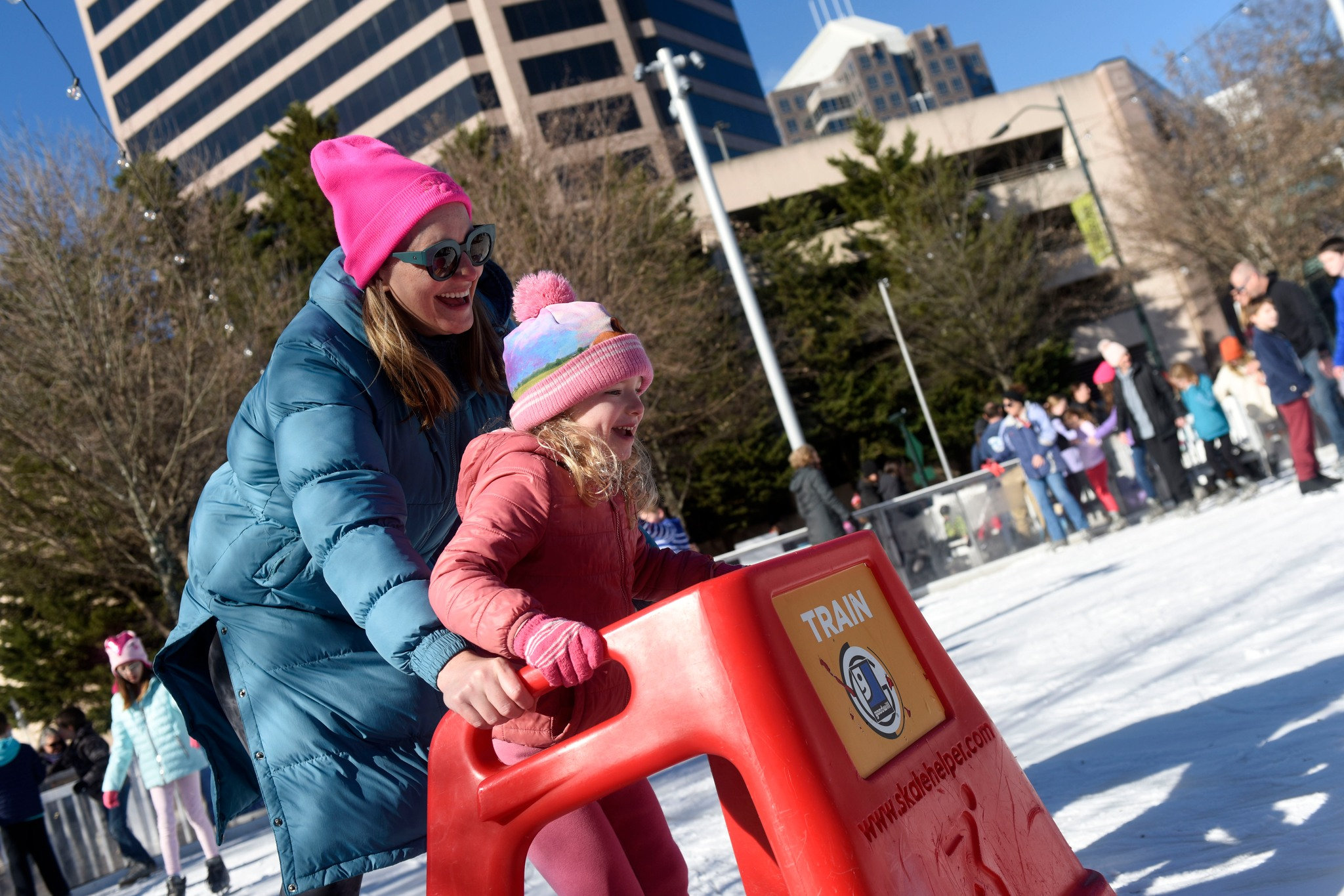 Photo of Friendly families ice skating in downtown Greensboro in January 2024